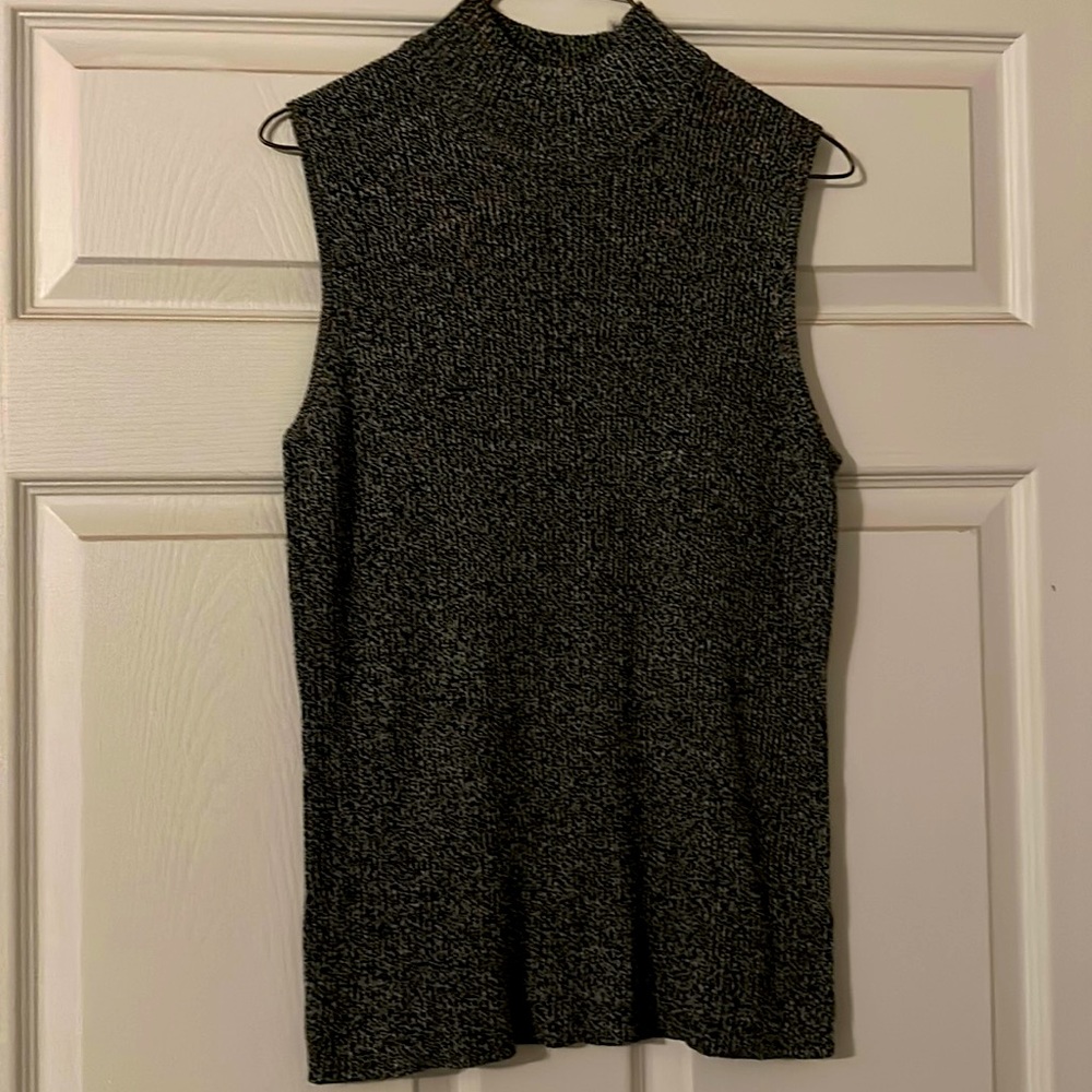 High neck sleeveless black/white sweater.